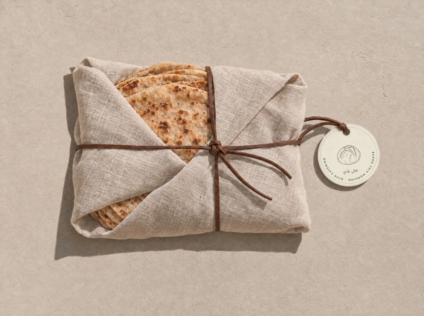 Bread parcel tied with leather and a round paper tag