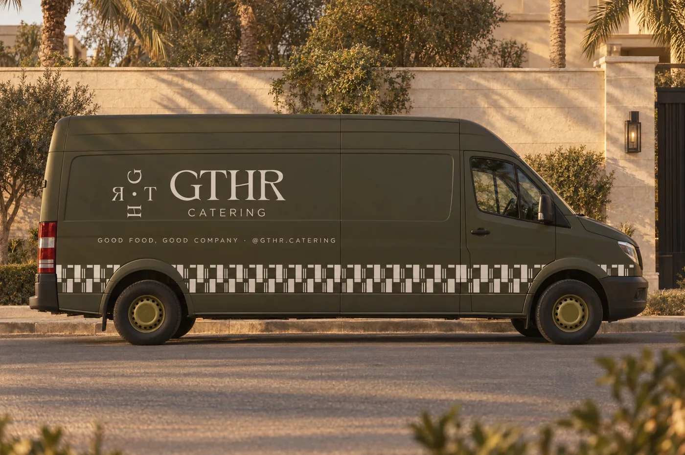 The olive GTHR van parked by a villa wall