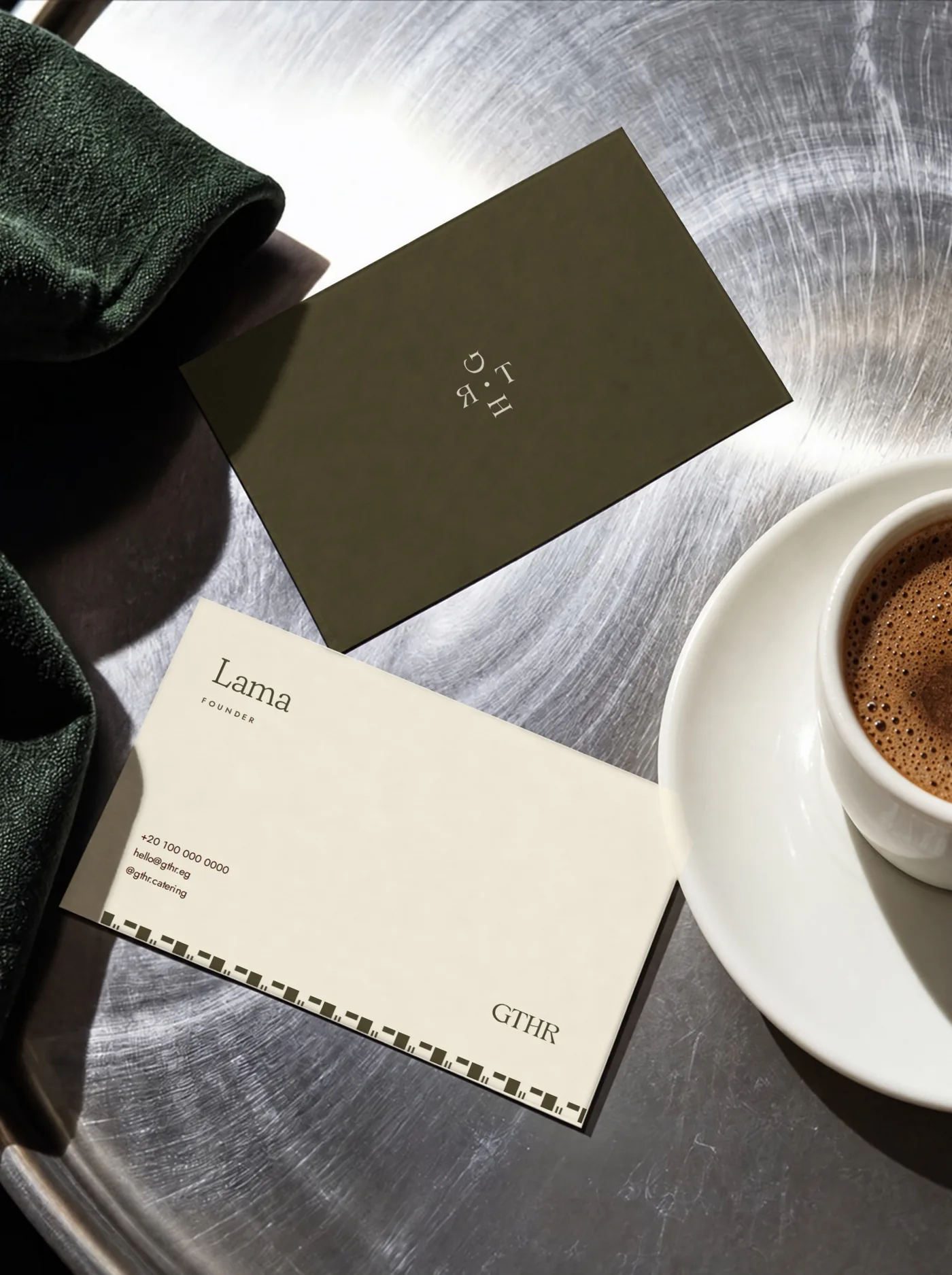 Business cards on a steel table with Turkish coffee